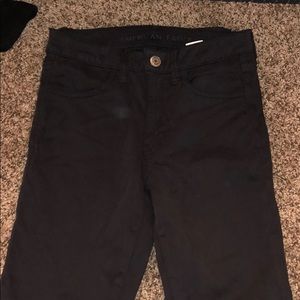 Black suede skinny jeans
